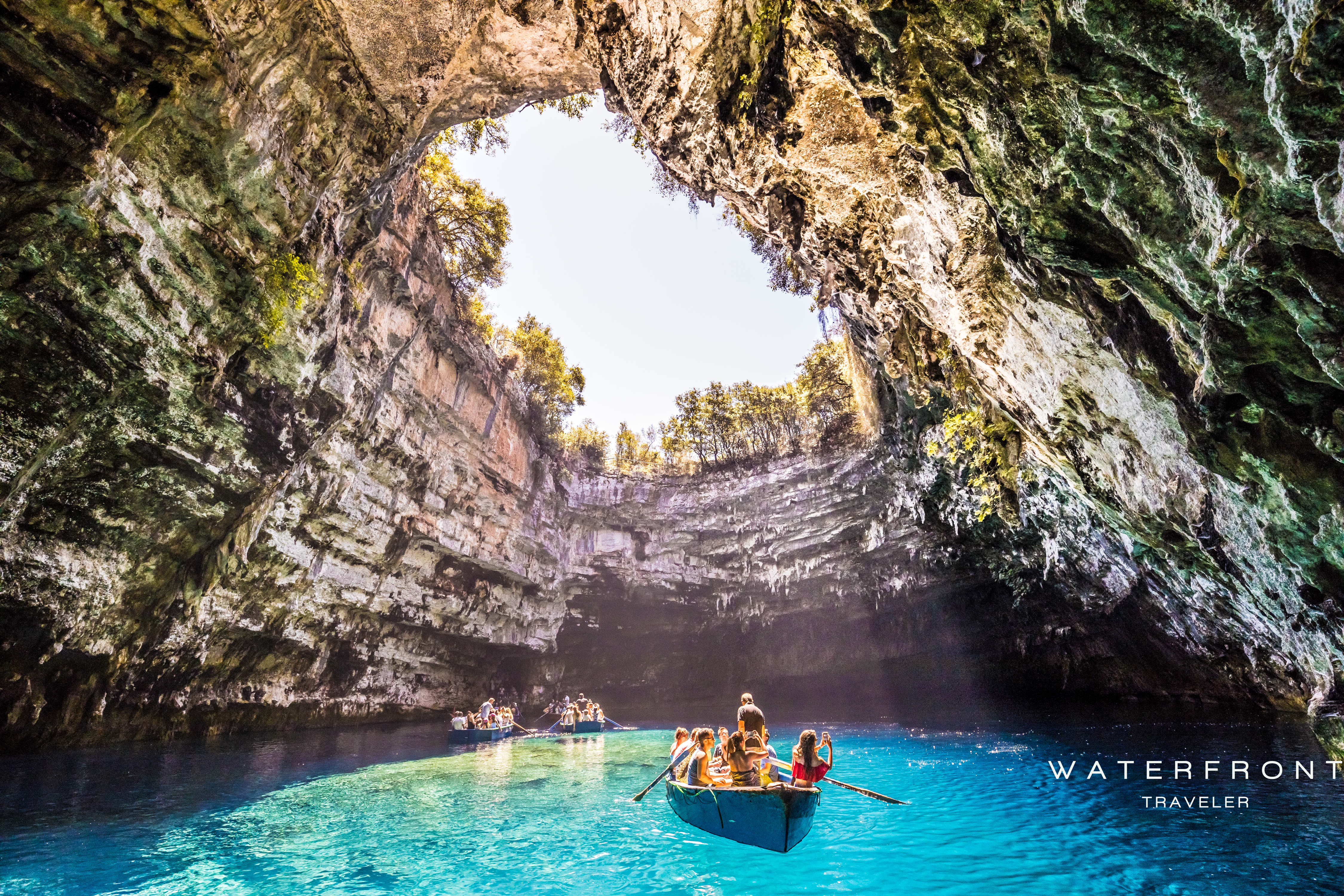 WaterfrontTraveler-wooden-boat-visit-famous-cave